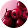 Un monton de cerezas brillantes, de color rojo oscuro a negro, llena la parte inferior y derecha del marco, sobre un fondo rosa suave.