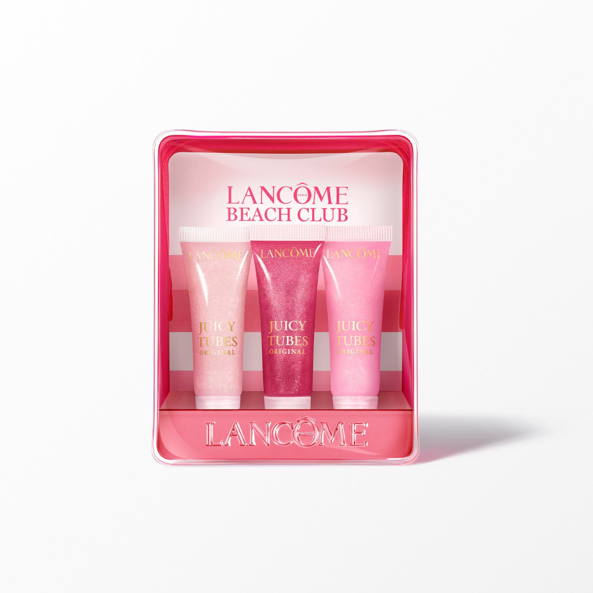 El set de brillos de labios se presenta junto con el neceser de rayas rosas como fondo de los tres tonos de brillo de labios