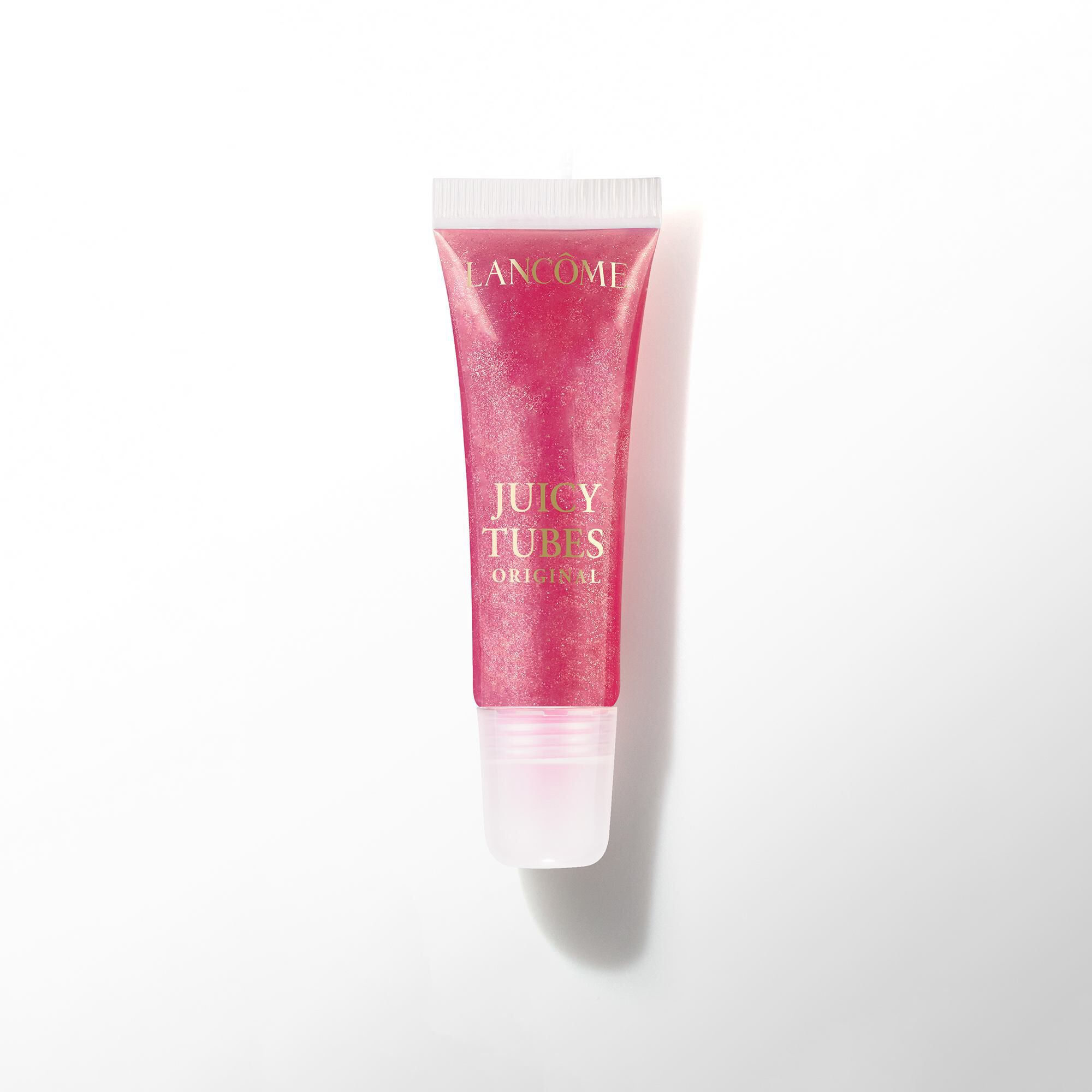 Un tubo de brillo de labios Lancome Juicy Tubes Original en un tono baya oscuro o magenta.