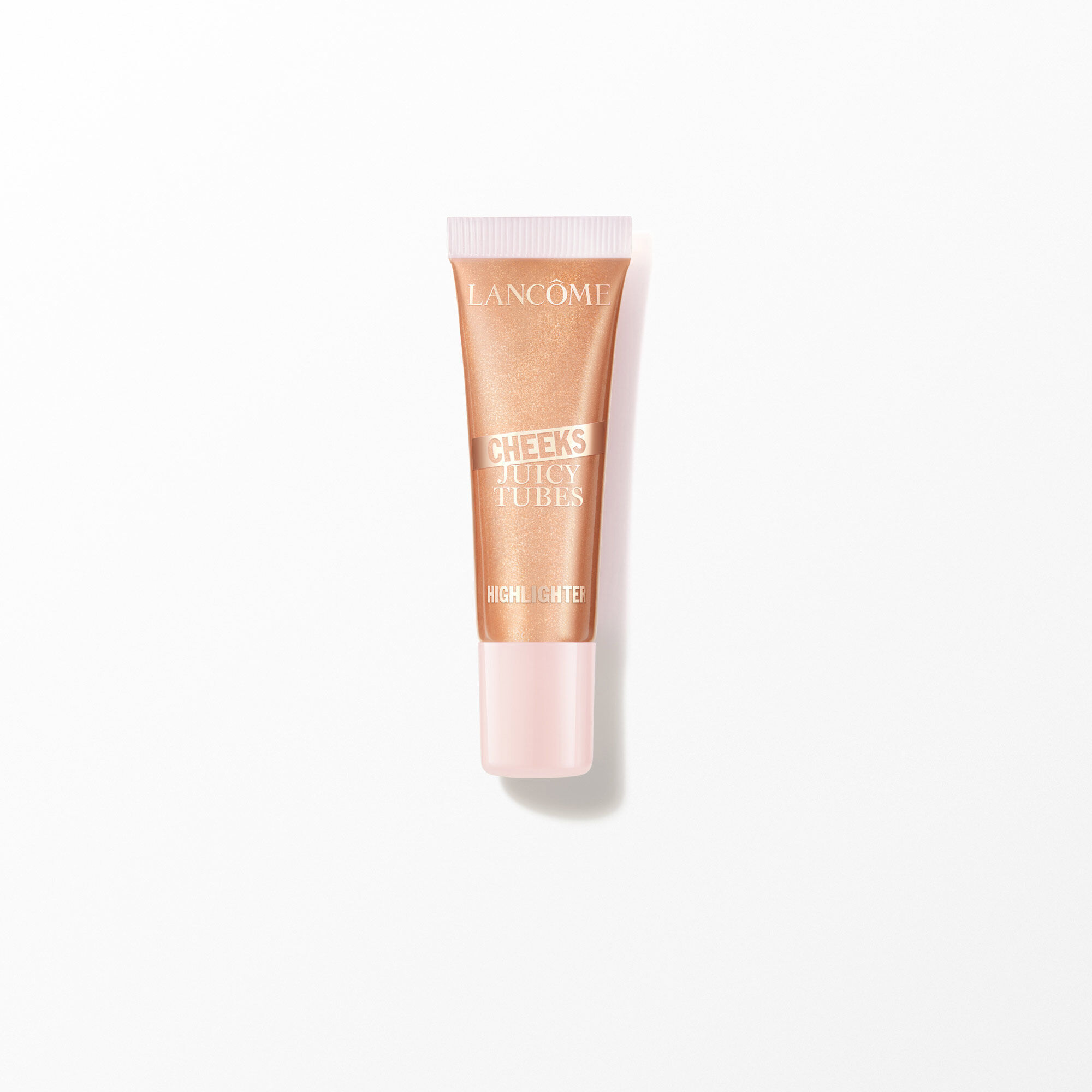 Tubo de iluminador de mejillas de tubos jugosos de Lancome sobre blanco.