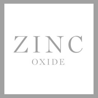 Texto alternativo: "Logo que muestra la palabra 'ZINC' en letras grandes y 'OXIDE' en letras mas pequenas, con fondo blanco."